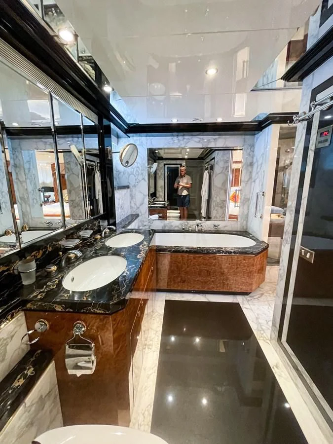 a bathroom with a large tub aboard OBSESSIONS Yacht for Sale