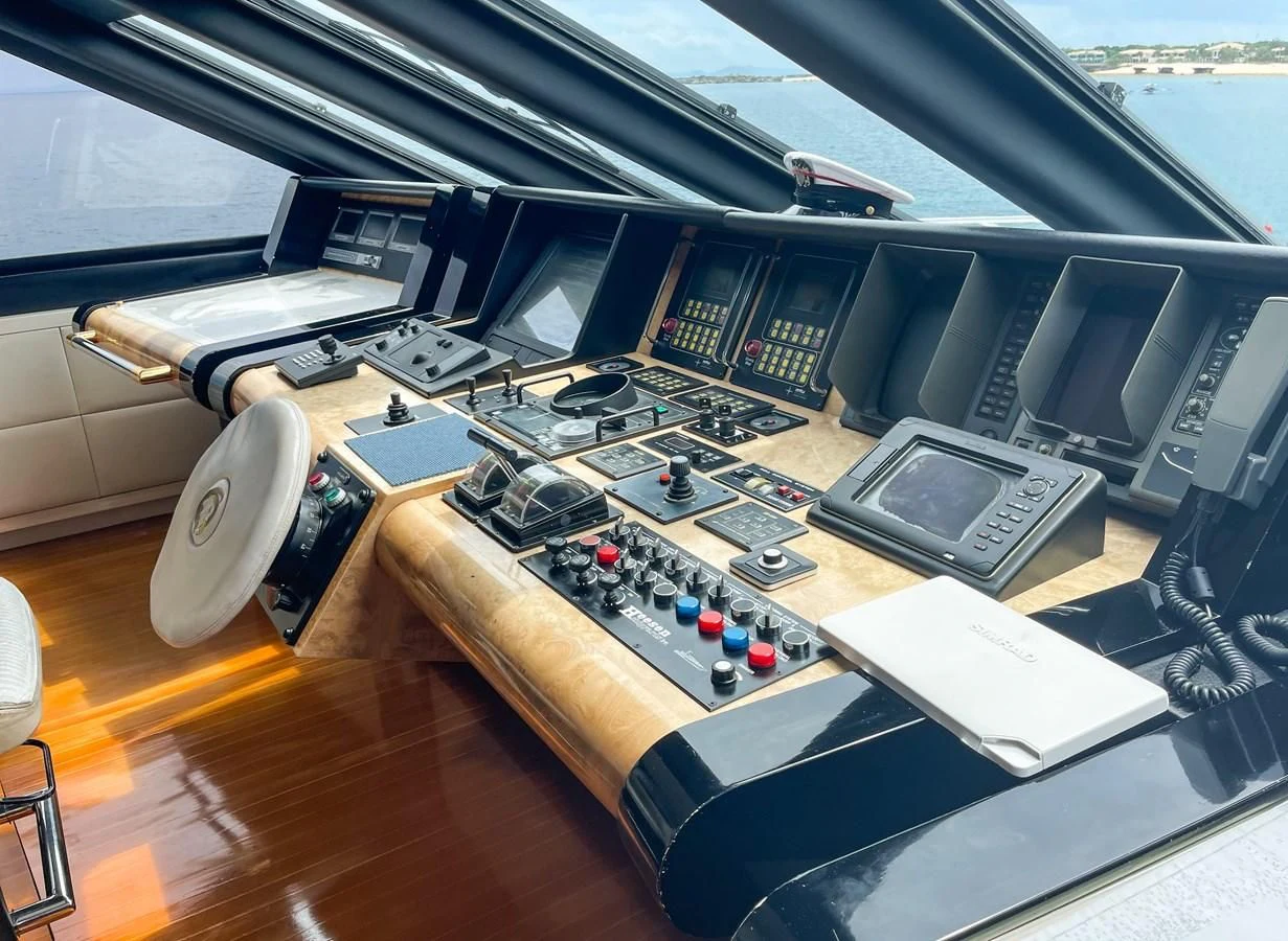 a room with many electronic devices aboard OBSESSIONS Yacht for Sale