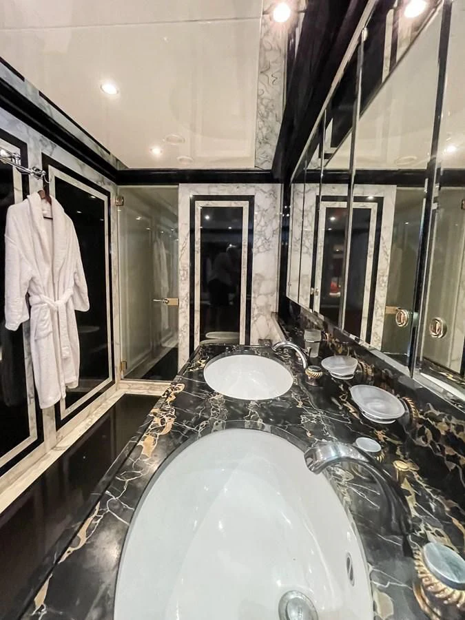 a bathroom with a large marble counter aboard OBSESSIONS Yacht for Sale