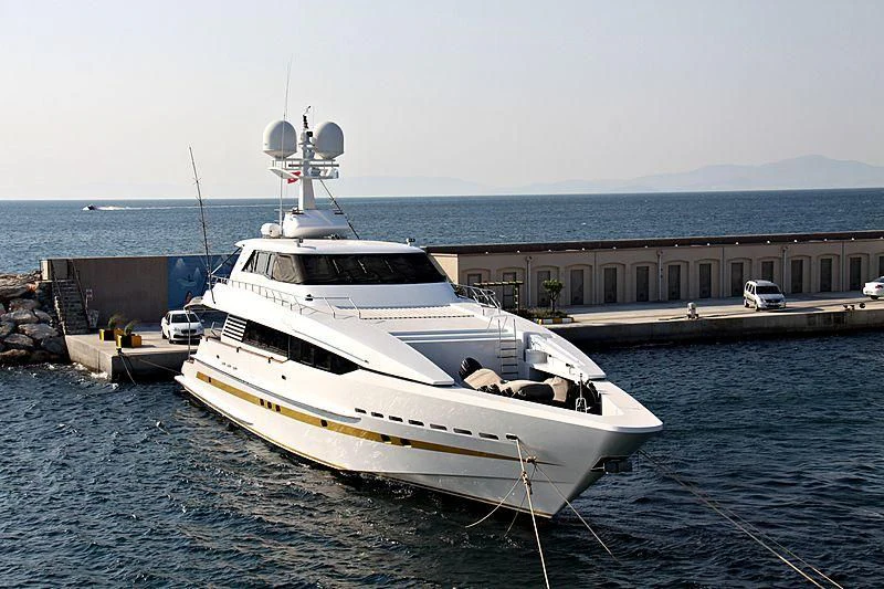 a boat tied to a dock aboard OBSESSIONS Yacht for Sale