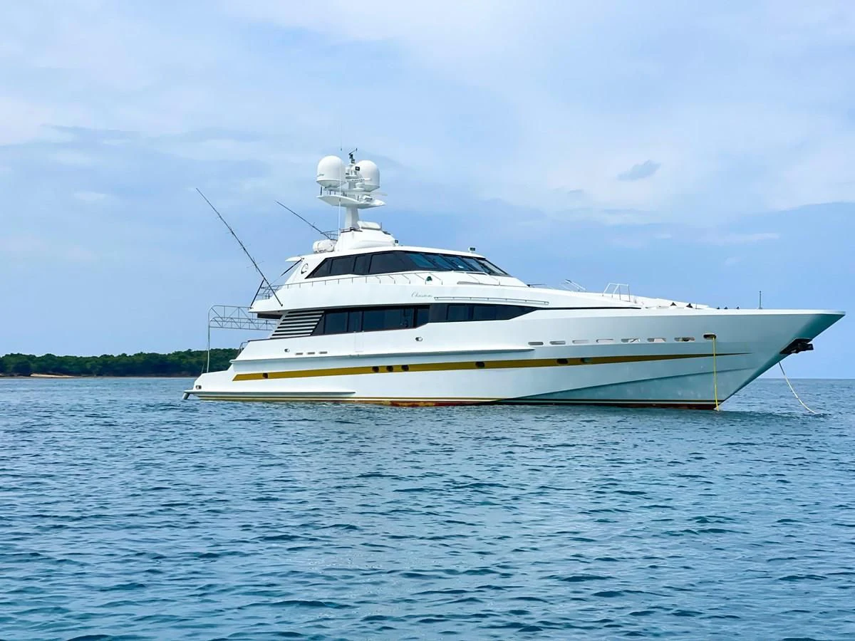 a white boat in the water aboard OBSESSIONS Yacht for Sale