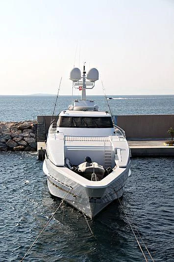 a boat tied to a dock aboard OBSESSIONS Yacht for Sale