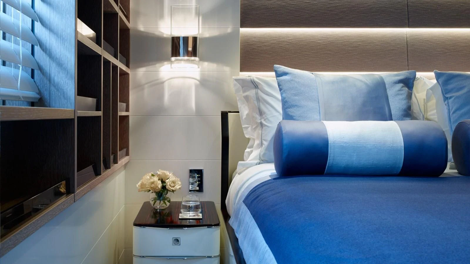a blue couch with a white table aboard ASYA Yacht for Sale