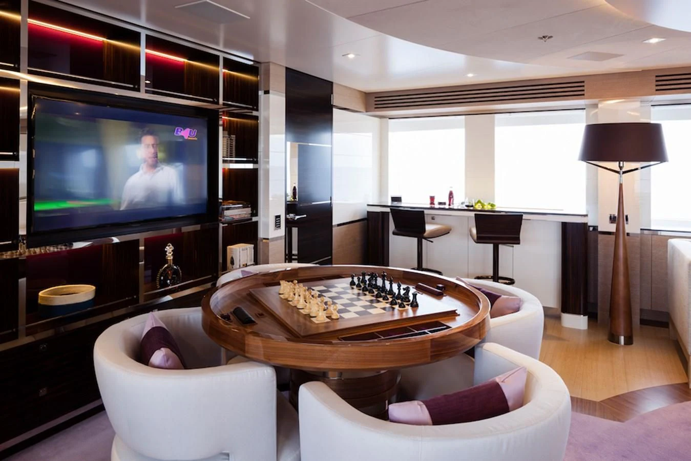 a living room with a television and a table aboard ASYA Yacht for Sale