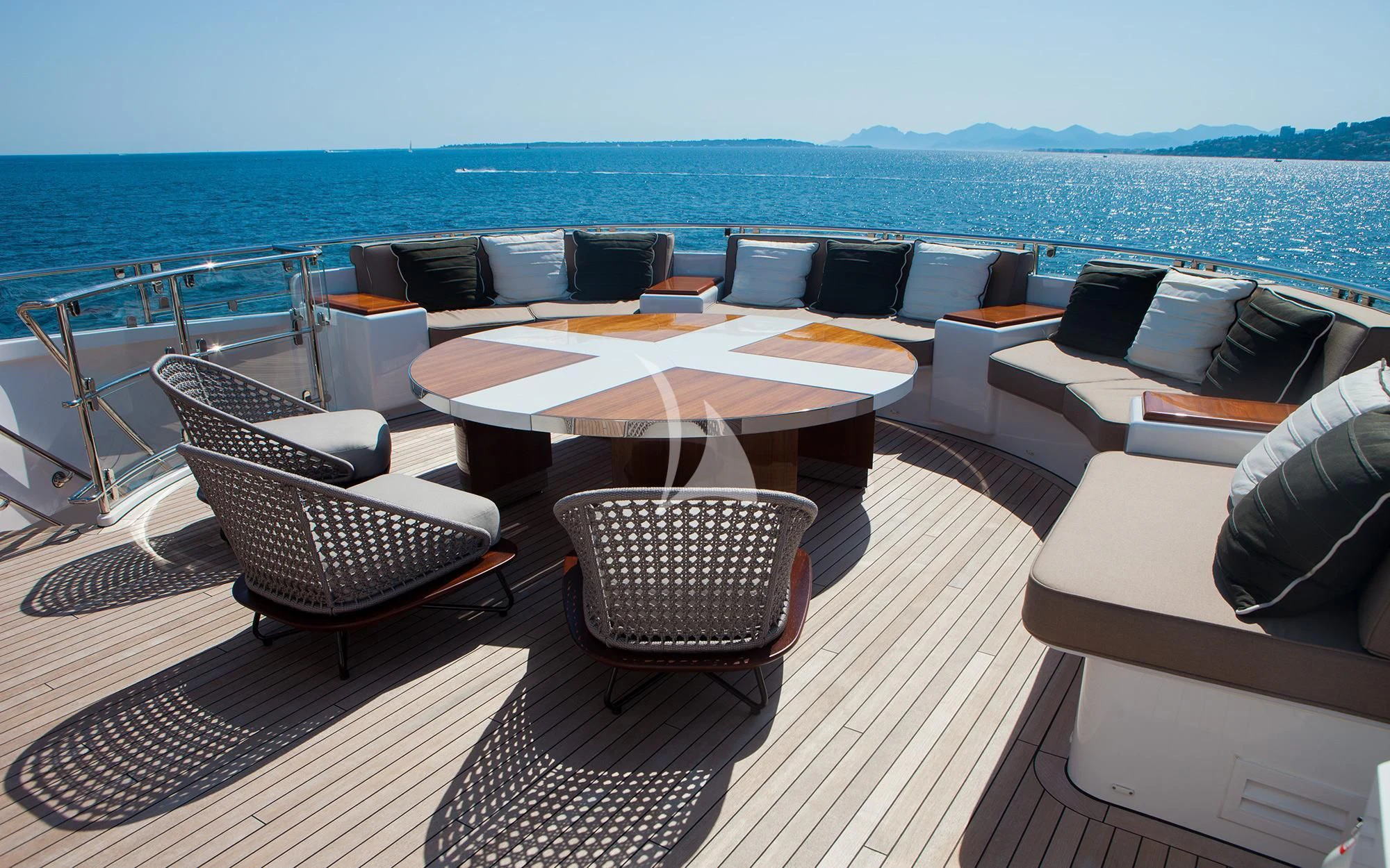 a deck with chairs and a table on it aboard ASYA Yacht for Sale