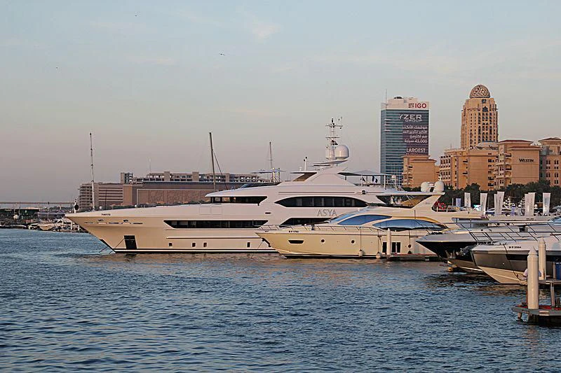 a large white boat sits in the water aboard ASYA Yacht for Sale