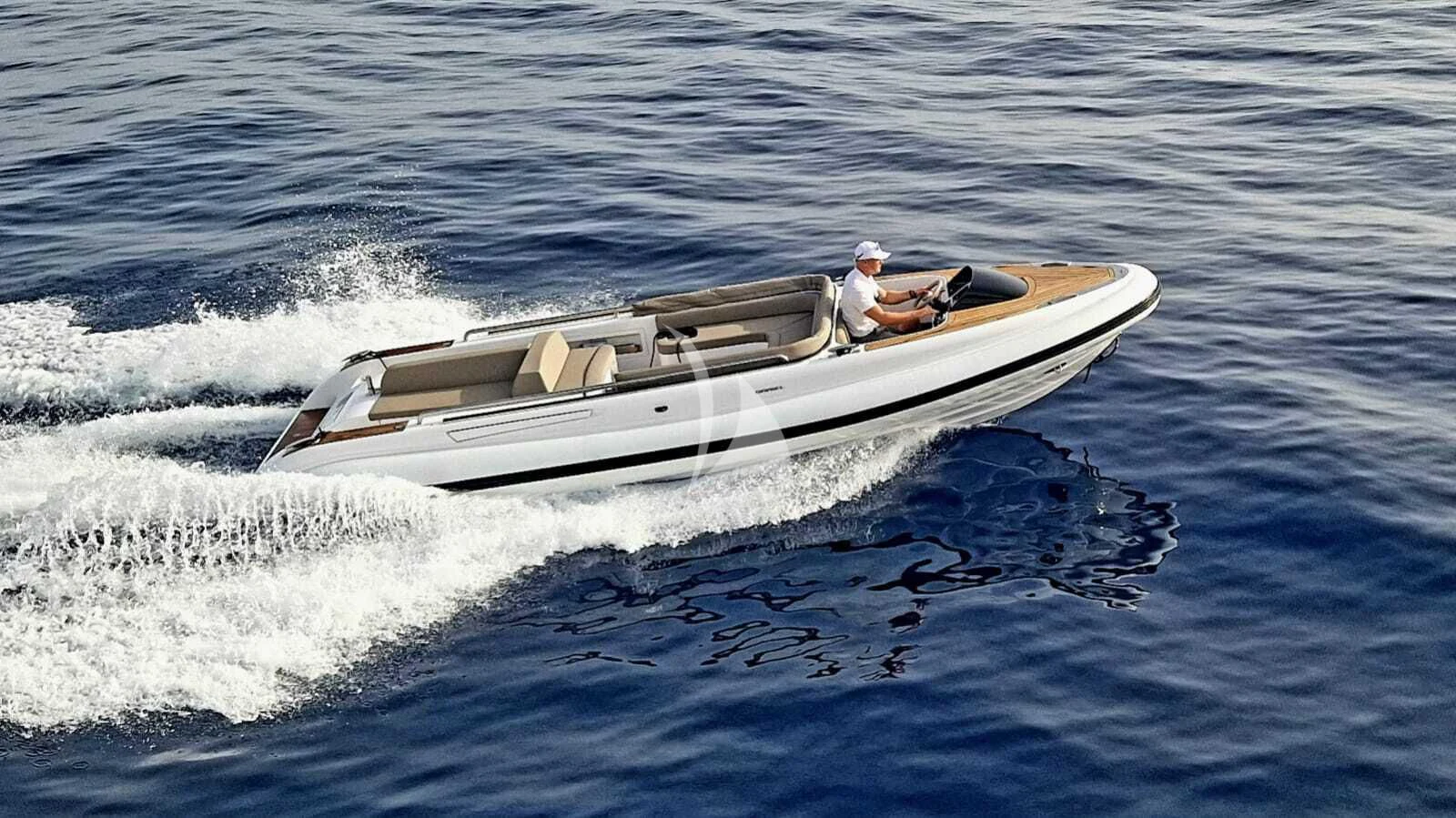 a person driving a boat aboard ASYA Yacht for Sale