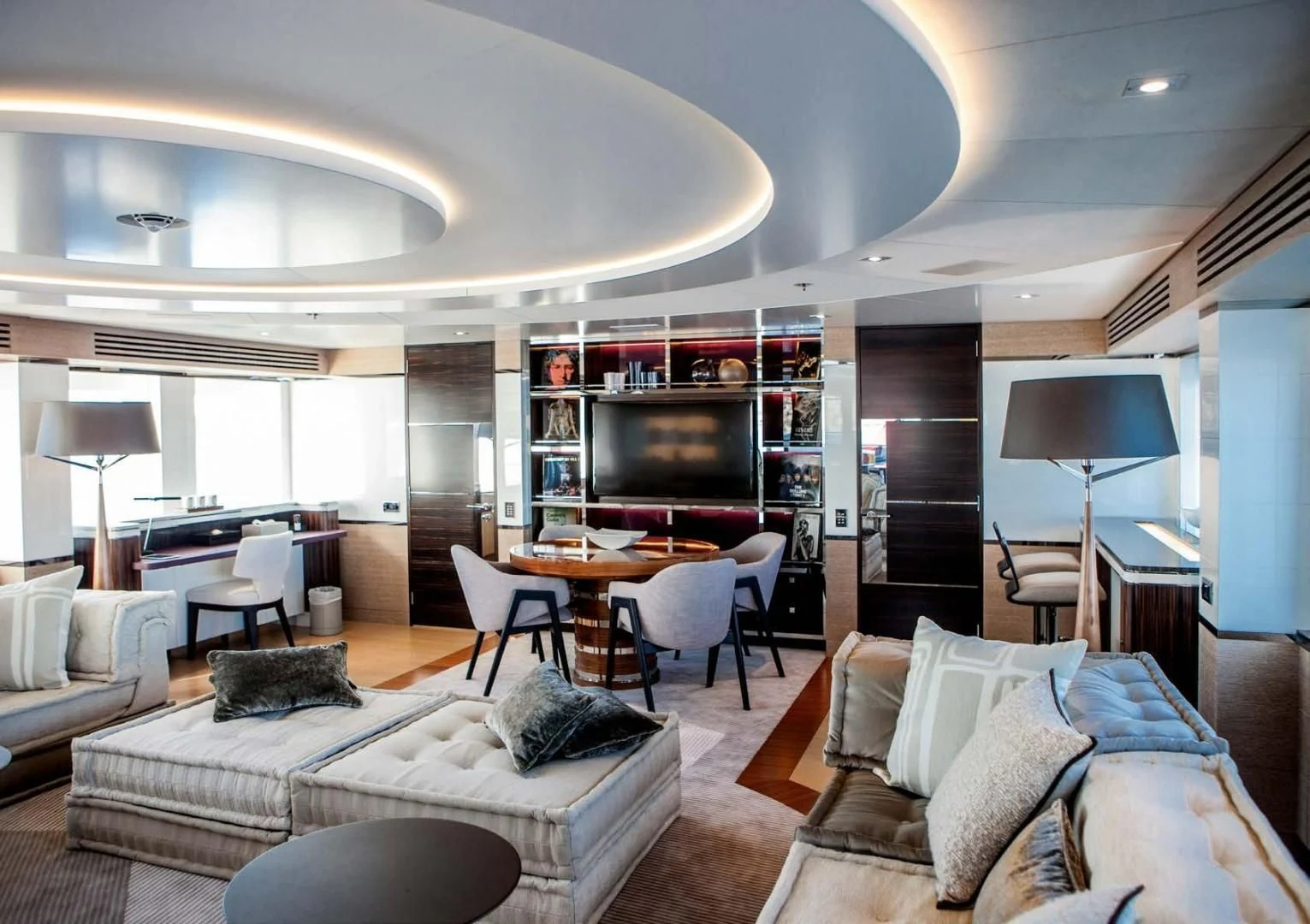 a living room with a fireplace aboard ASYA Yacht for Sale