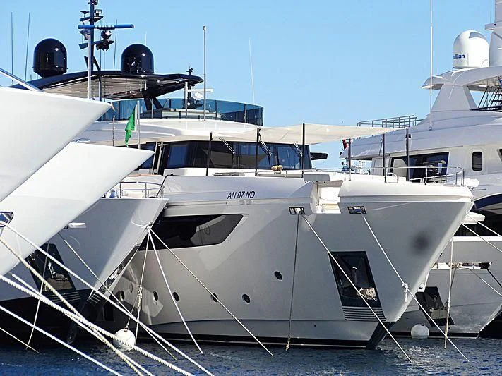 a white boat with black wheels aboard FOUR FLOWERS III Yacht for Sale