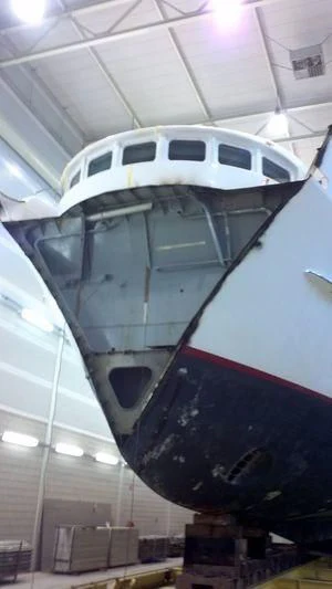 a large helicopter in a hangar aboard THE LADY K Yacht for Sale