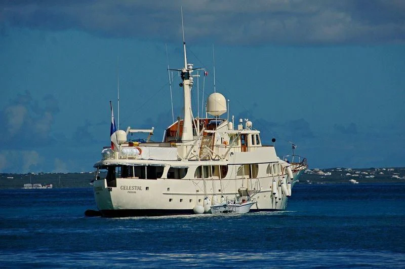 a large white boat in the water aboard CELESTIAL Yacht for Sale