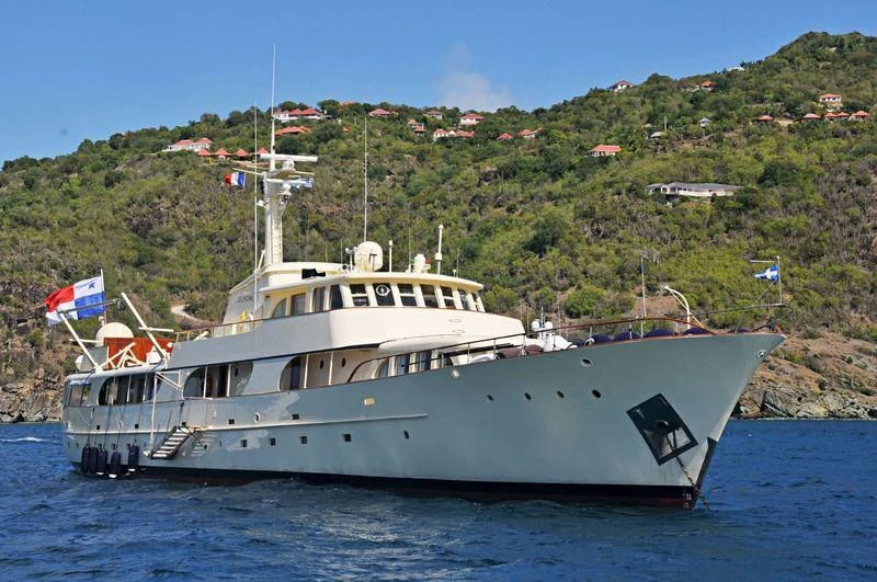 a large white boat in the water aboard CELESTIAL Yacht for Sale