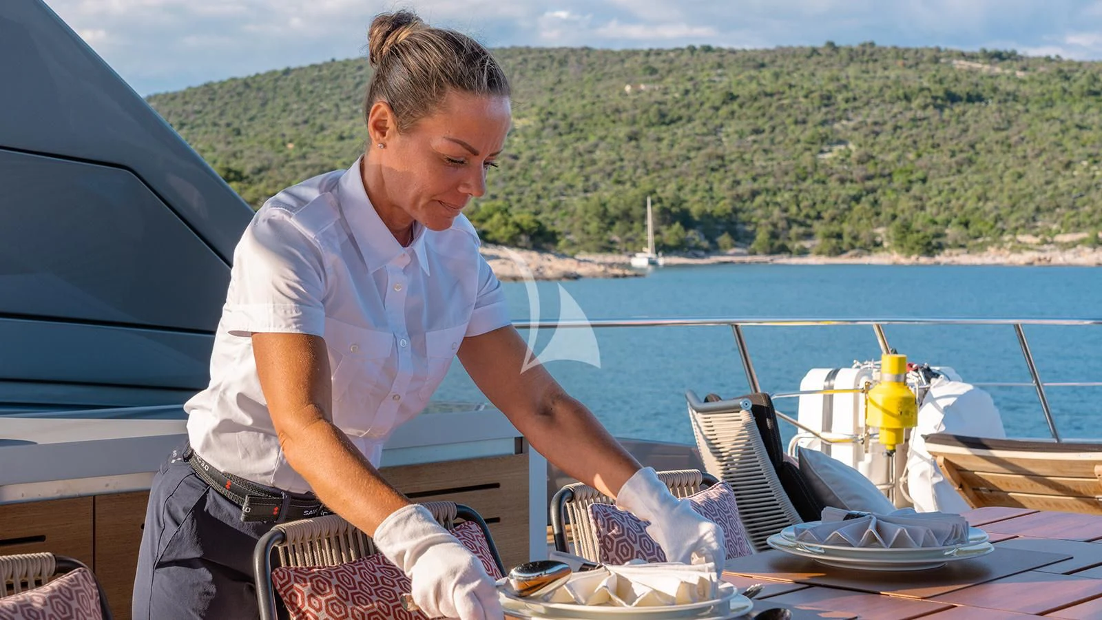 a man sitting at a table aboard JOURNEY Yacht for Sale