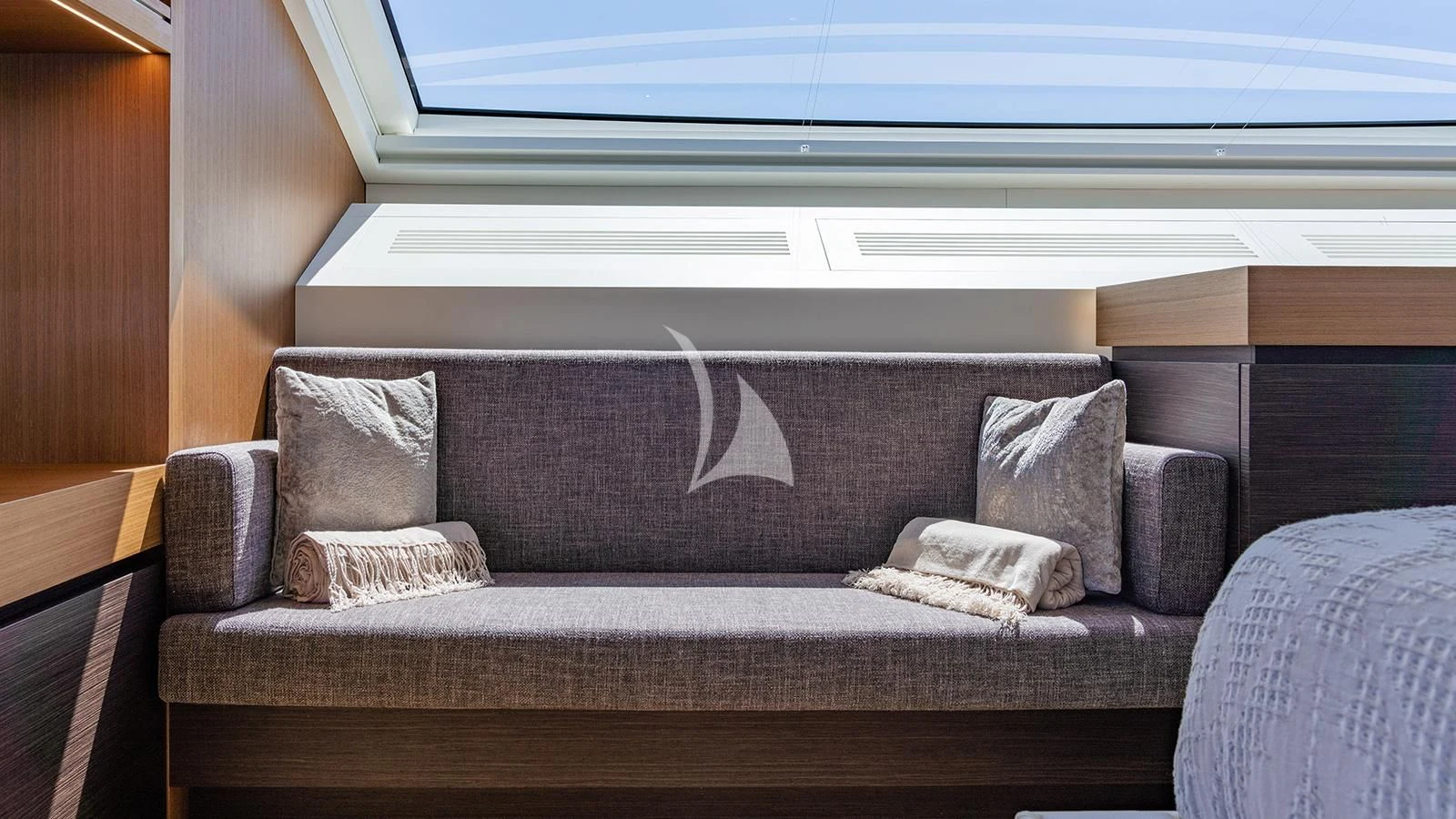 a couch with pillows aboard JOURNEY Yacht for Sale