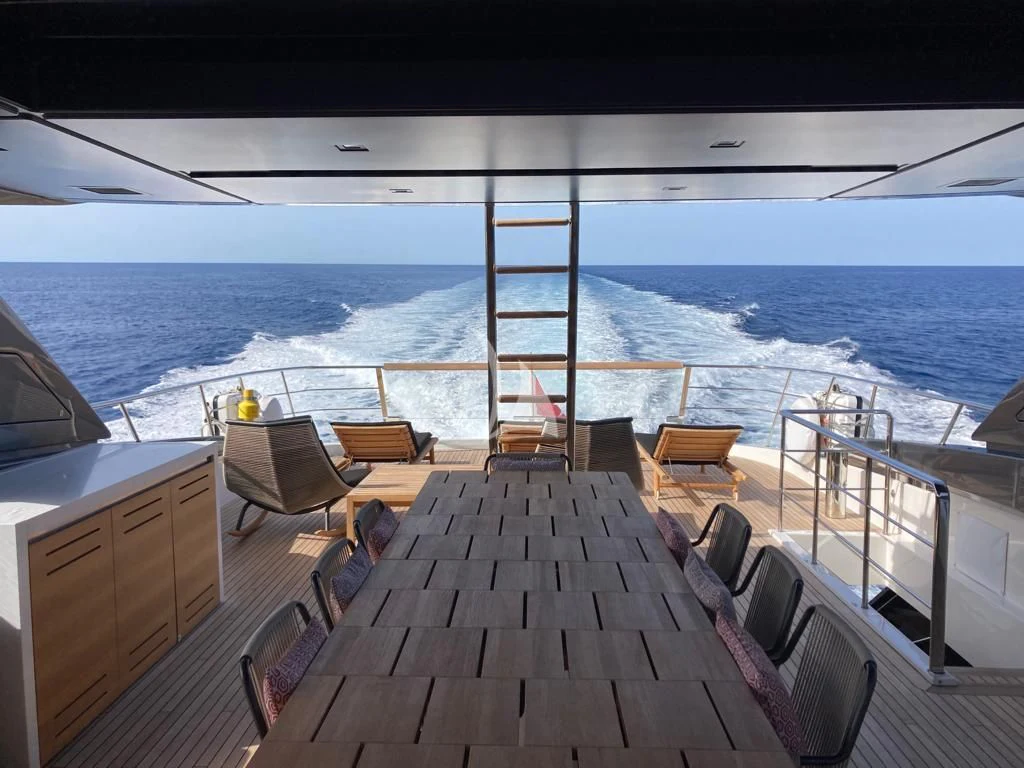 a deck with chairs and a large body of water aboard JOURNEY Yacht for Sale