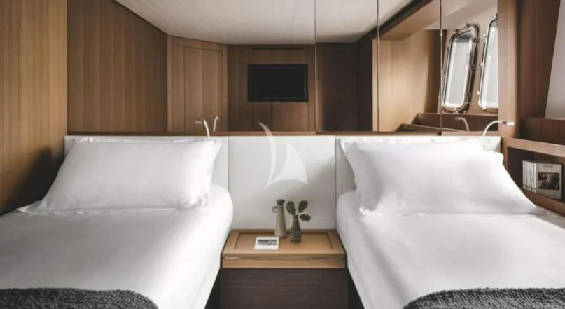 a room with two beds aboard JOURNEY Yacht for Sale
