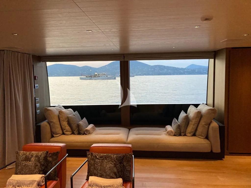 a living room with a large window aboard JOURNEY Yacht for Sale
