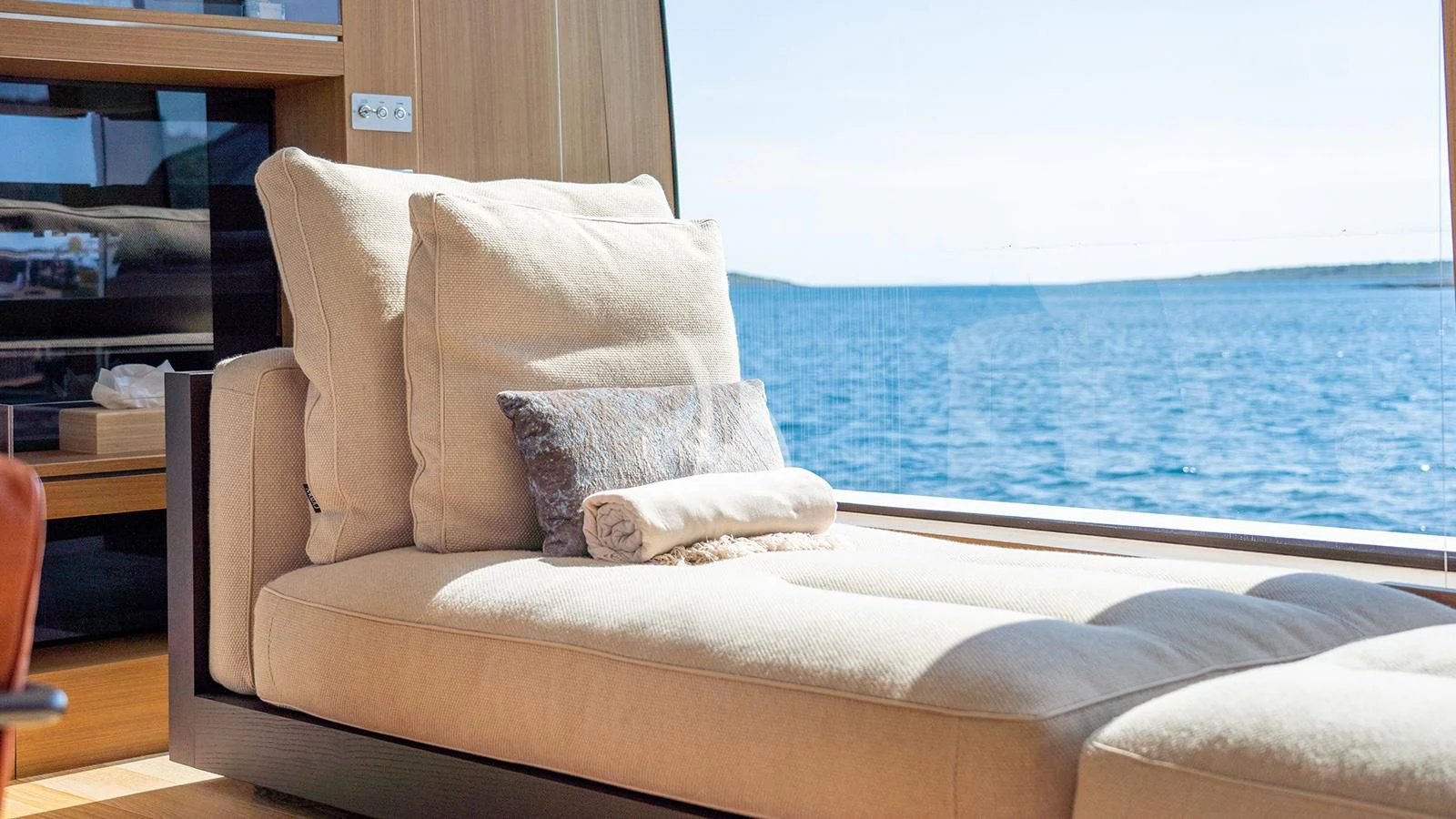 a couch with pillows on it aboard JOURNEY Yacht for Sale