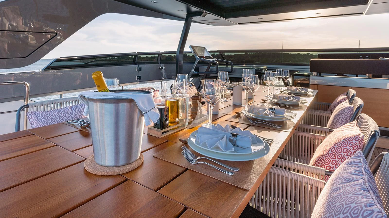 a table with plates and glasses on it aboard JOURNEY Yacht for Sale