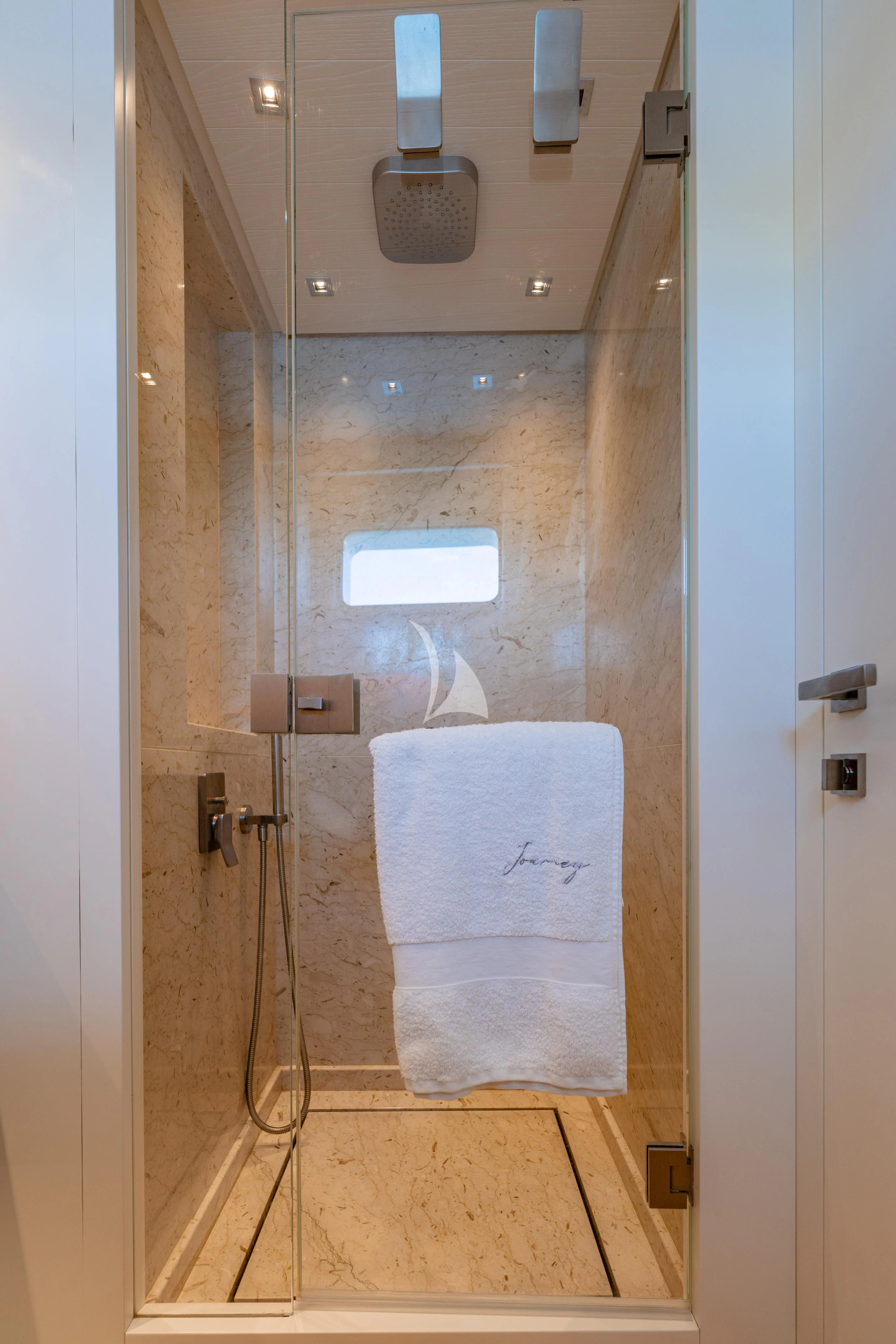 a shower unit with a towel from the wall aboard JOURNEY Yacht for Sale