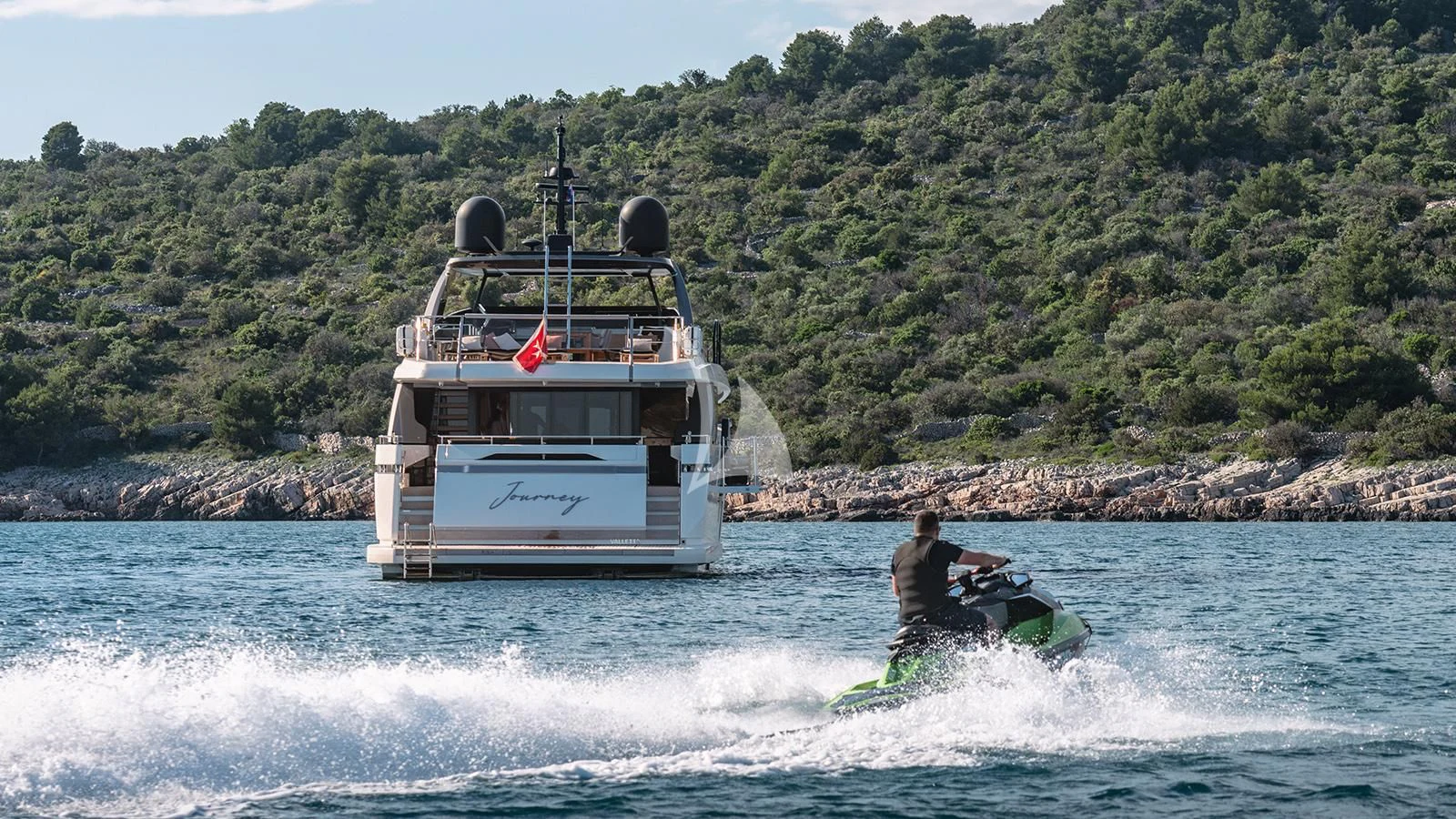 a man on a jet ski in the water aboard JOURNEY Yacht for Sale