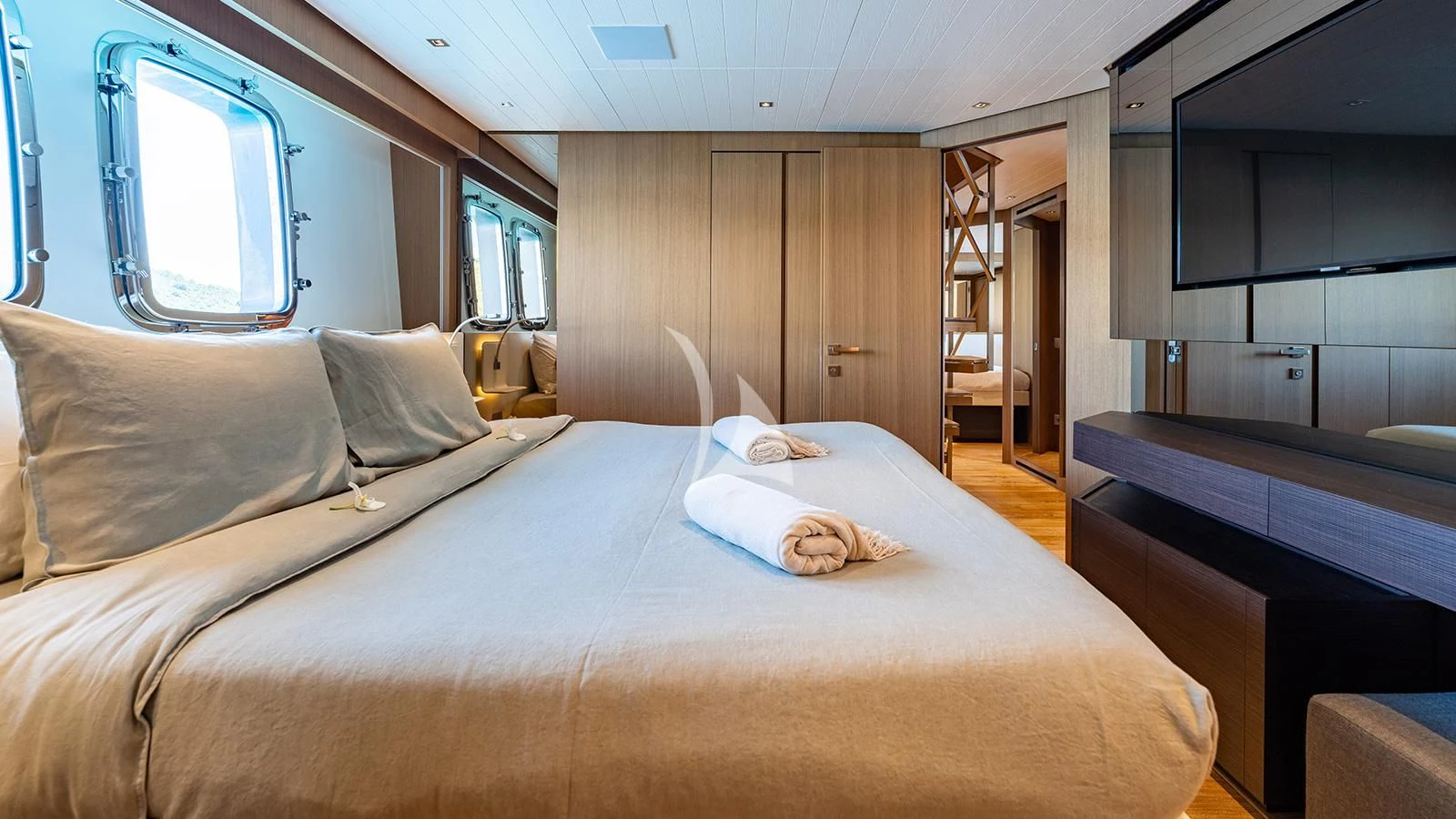 a bedroom with a bed and a window aboard JOURNEY Yacht for Sale
