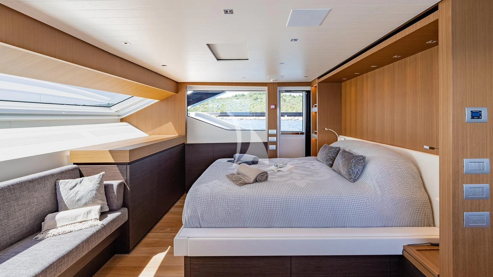 a room with a bed and a couch aboard JOURNEY Yacht for Sale