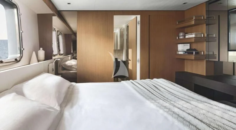 a bed with white sheets aboard JOURNEY Yacht for Sale