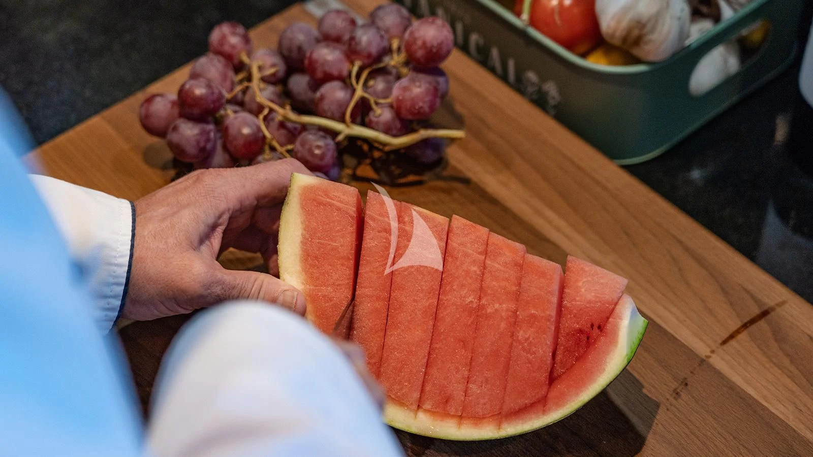 a person holding a plate of food aboard JOURNEY Yacht for Sale
