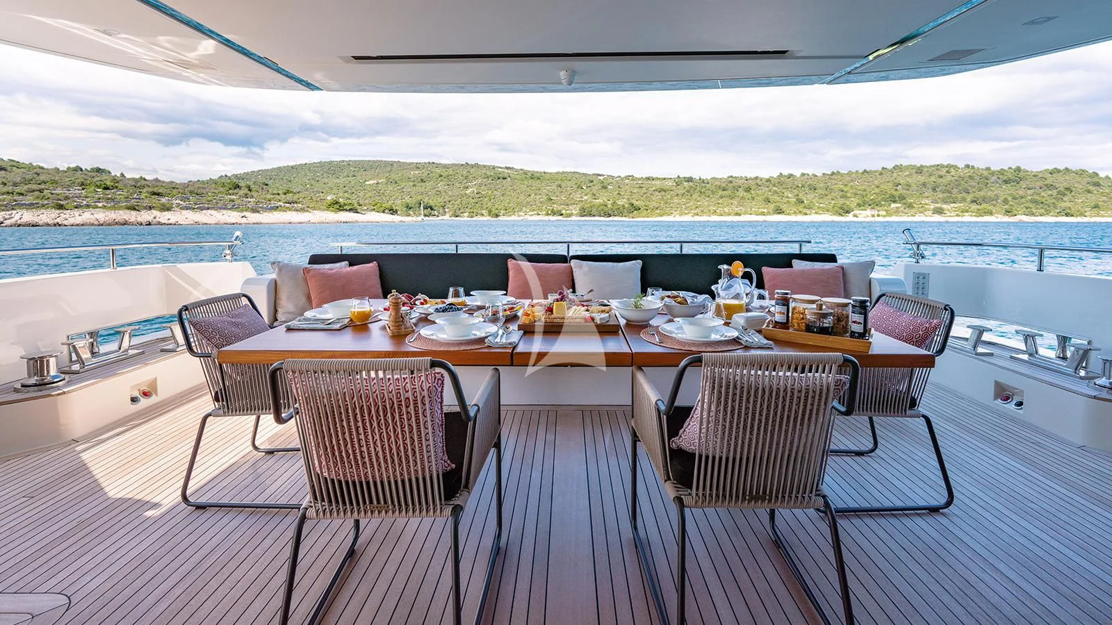 a table set for a meal on a boat aboard JOURNEY Yacht for Sale