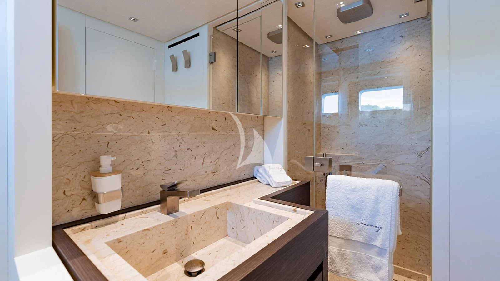 a bathroom with a sink and a mirror aboard JOURNEY Yacht for Sale
