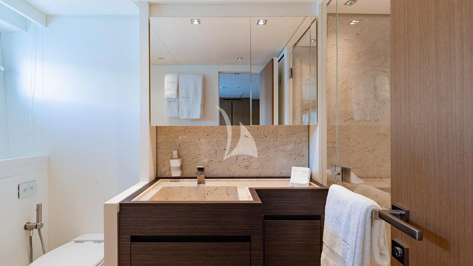 a bathroom with a large mirror aboard JOURNEY Yacht for Sale