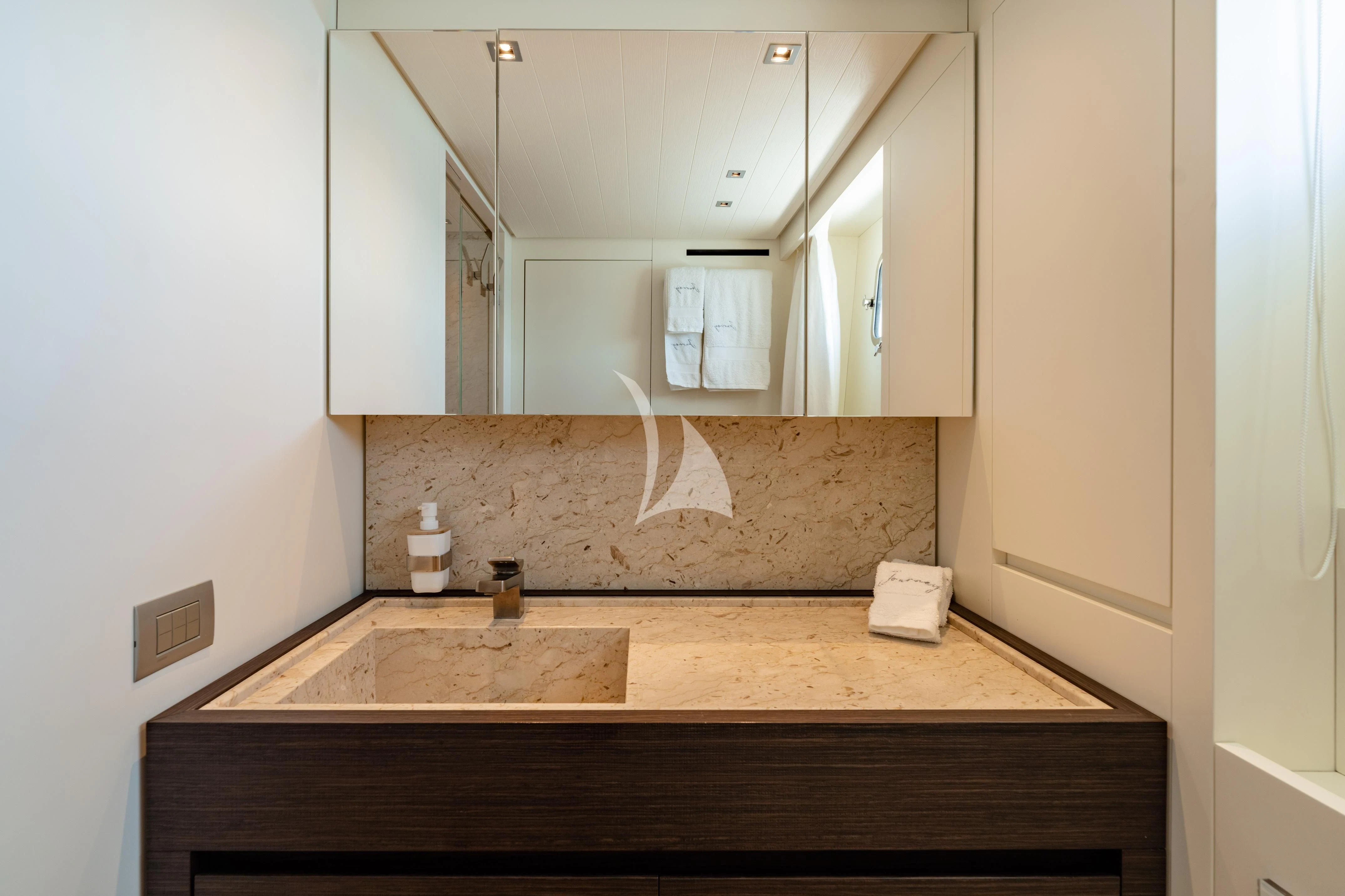 a kitchen with a sink and cabinets aboard JOURNEY Yacht for Sale