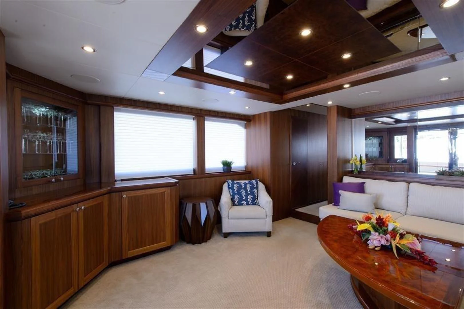 a living room with a couch and a table aboard RHONDAVOUS Yacht for Sale