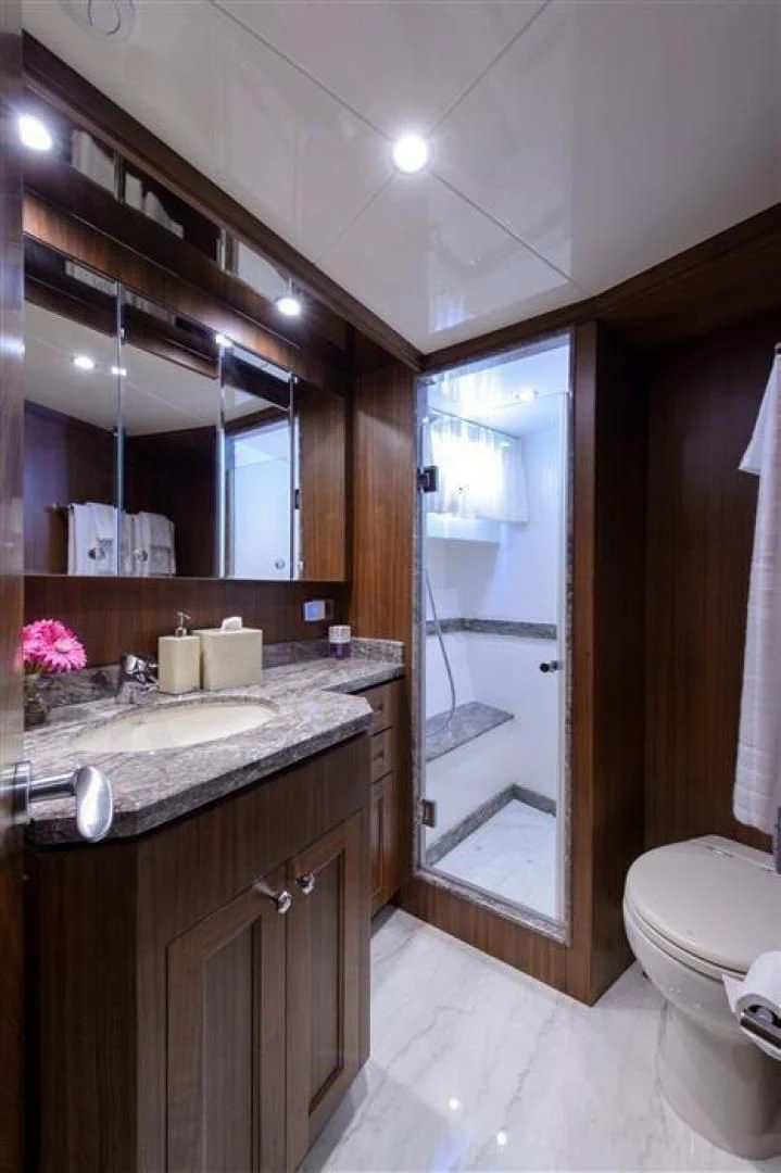 a bathroom with a large mirror aboard RHONDAVOUS Yacht for Sale