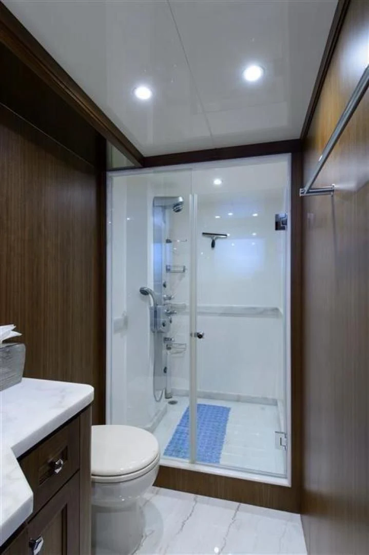 a bathroom with a shower and a toilet aboard RHONDAVOUS Yacht for Sale