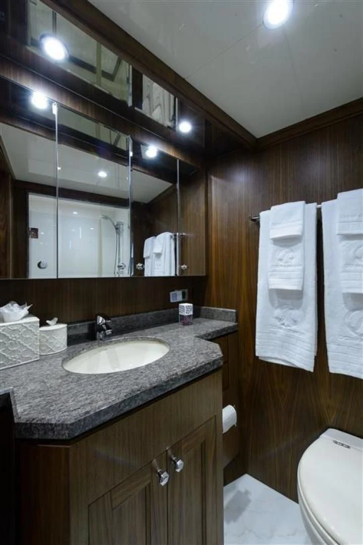 a bathroom with a sink and a mirror aboard RHONDAVOUS Yacht for Sale