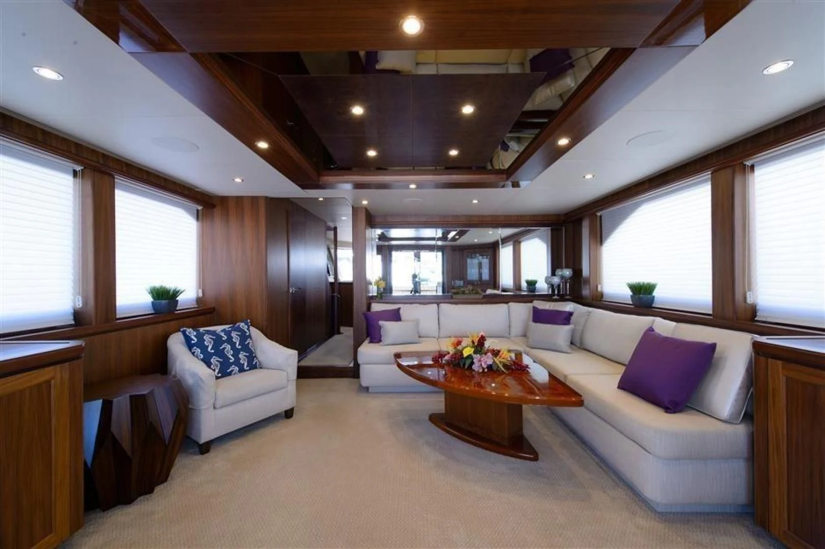 a living room with a couch and a table aboard RHONDAVOUS Yacht for Sale