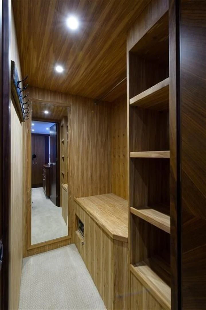 a wooden staircase with a mirror aboard RHONDAVOUS Yacht for Sale