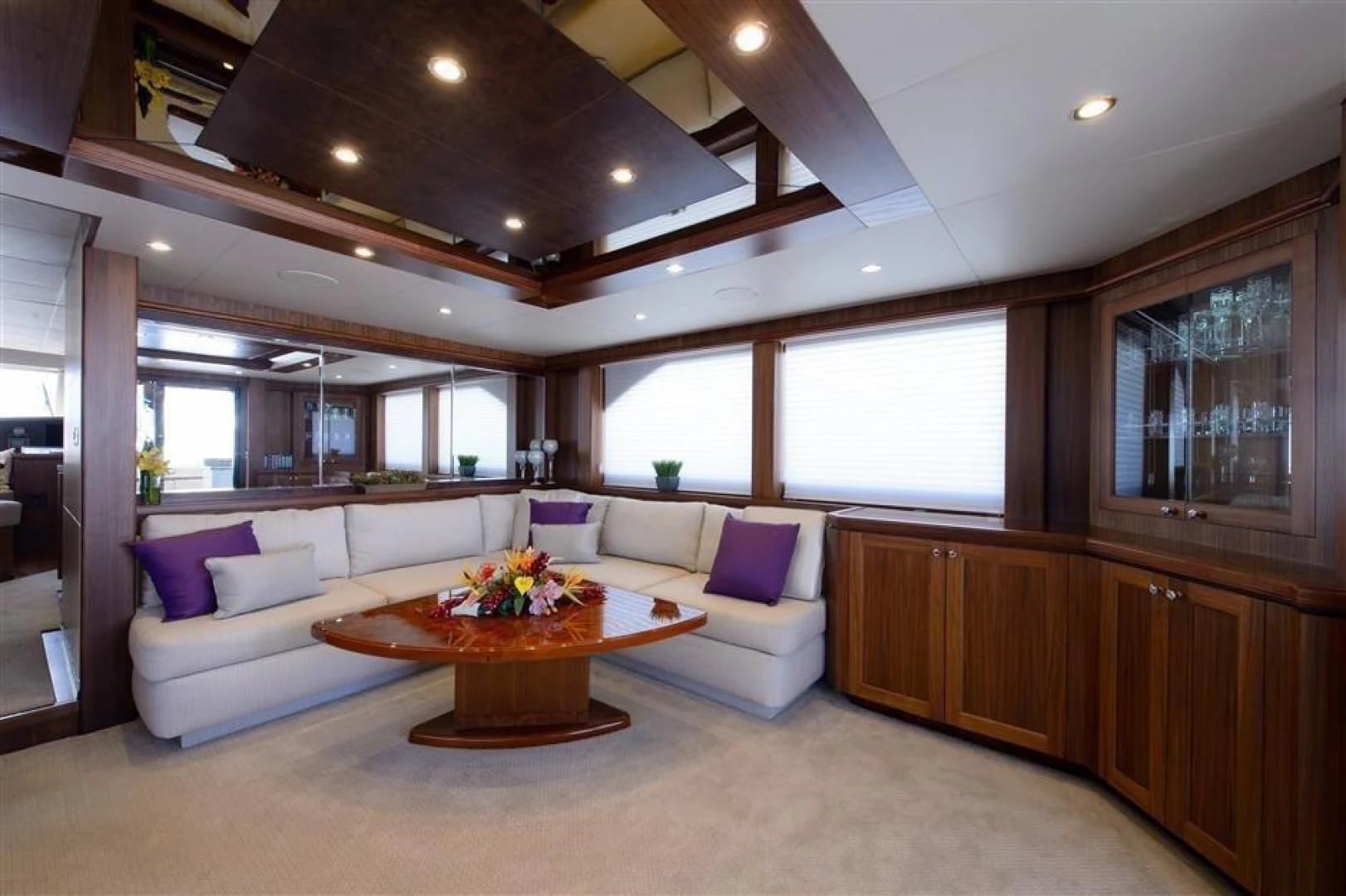 a living room with a couch and a table aboard RHONDAVOUS Yacht for Sale