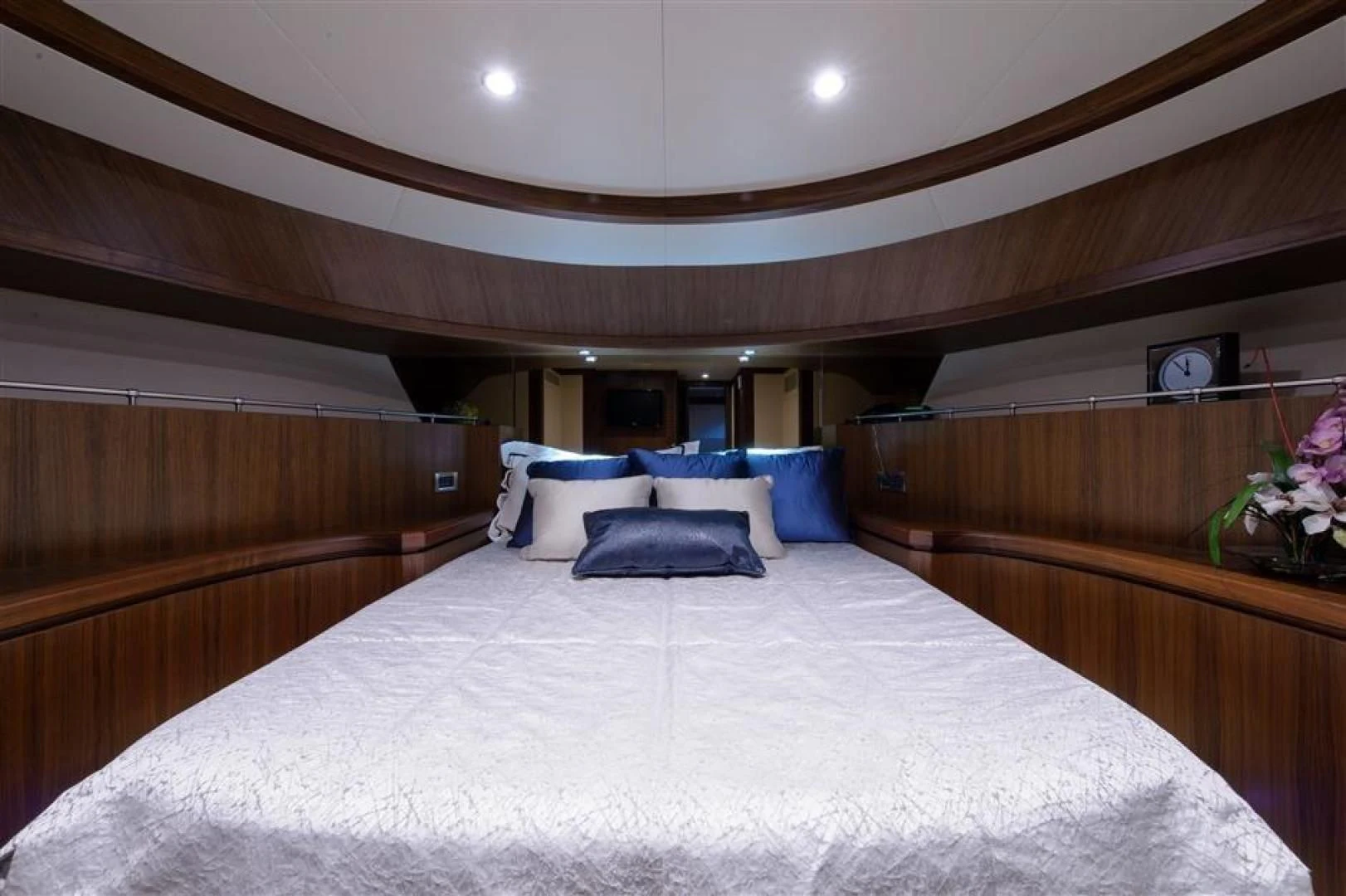 a bed with a white sheet and pillows aboard RHONDAVOUS Yacht for Sale