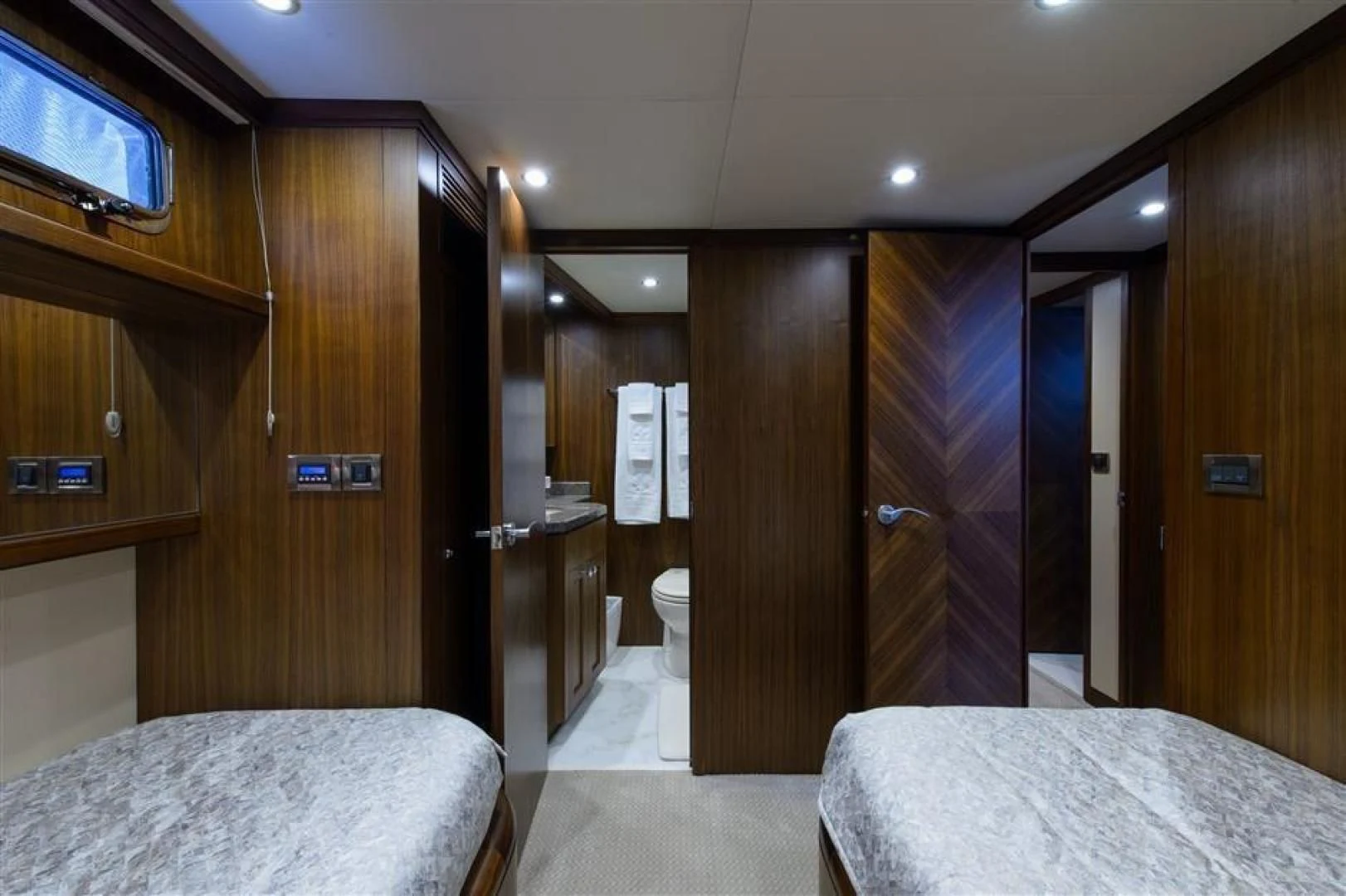 a hotel room with a bed and a closet aboard RHONDAVOUS Yacht for Sale