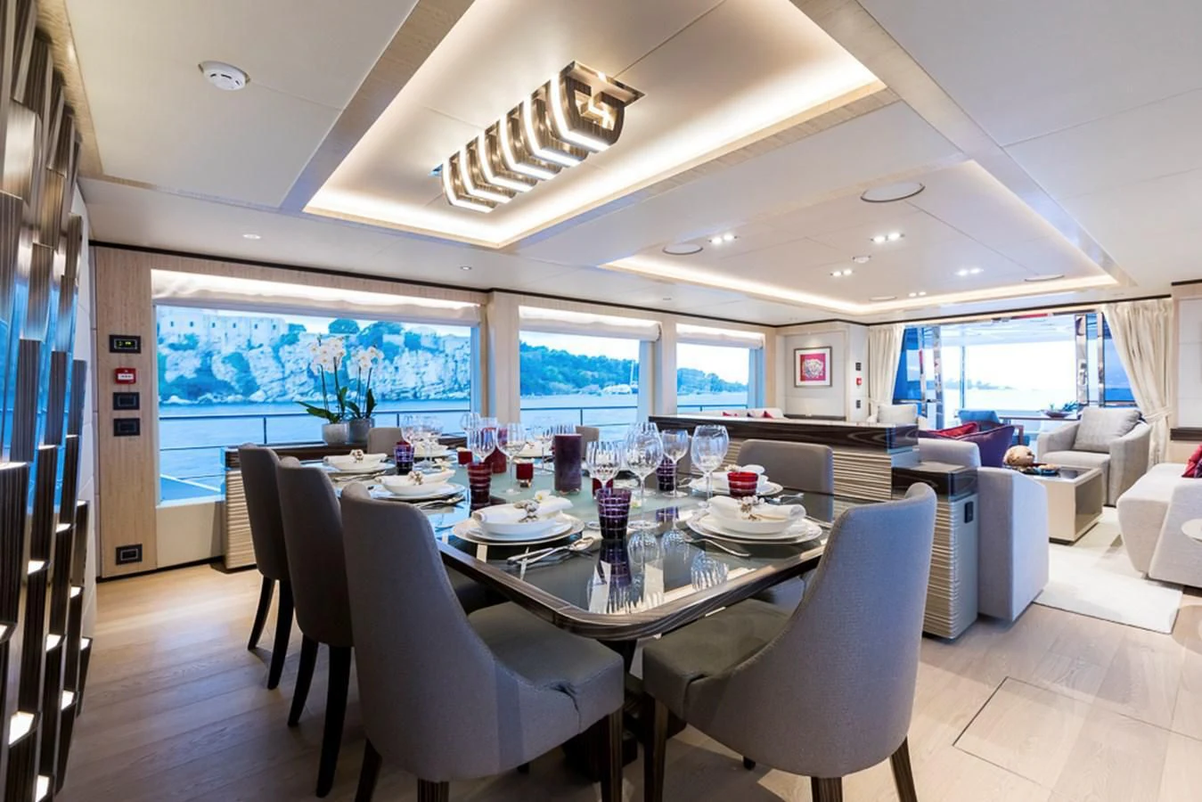 a large dining room with a large table and chairs aboard MAJESTY 100 Yacht for Sale