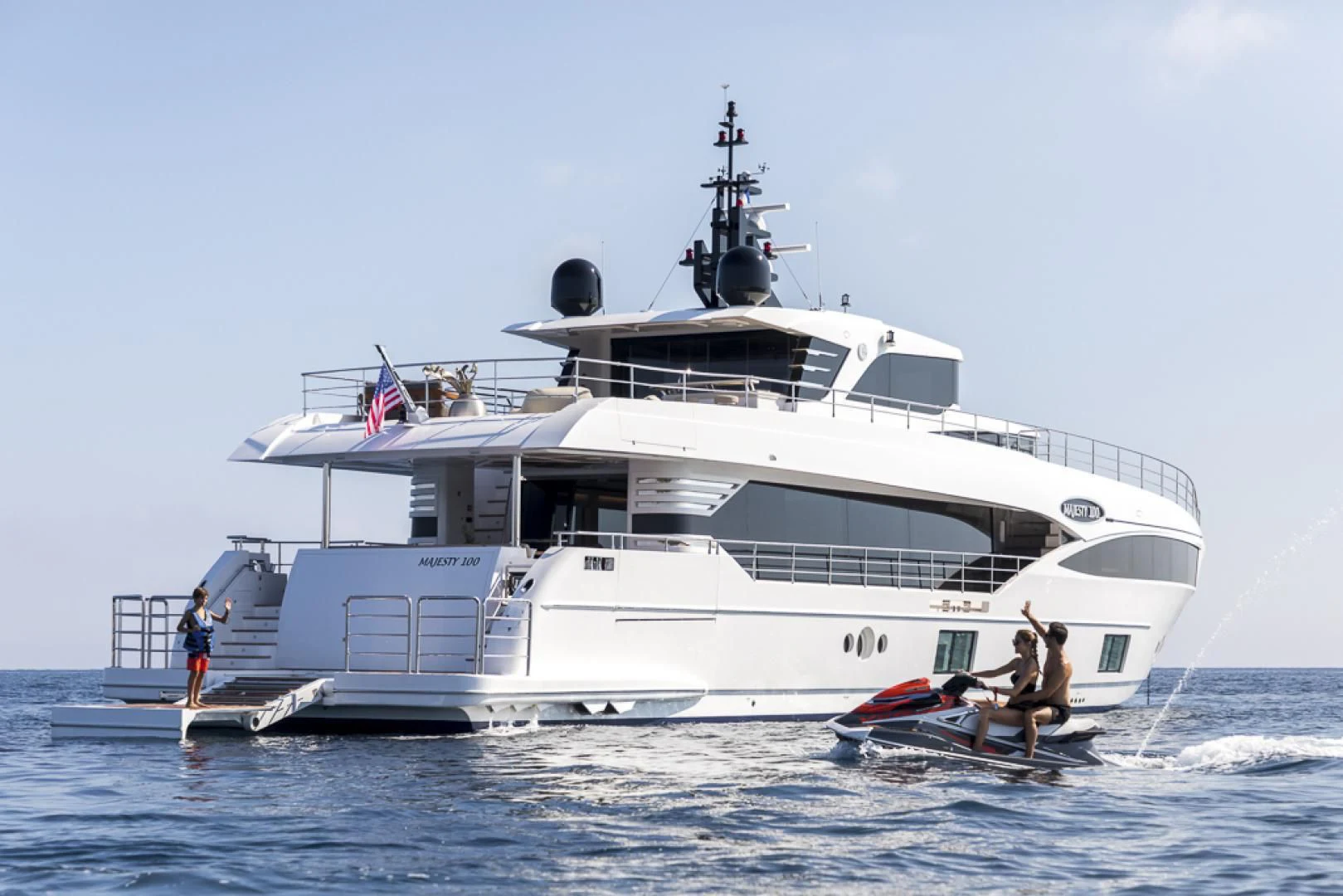 a large white boat with a person on it aboard MAJESTY 100 Yacht for Sale