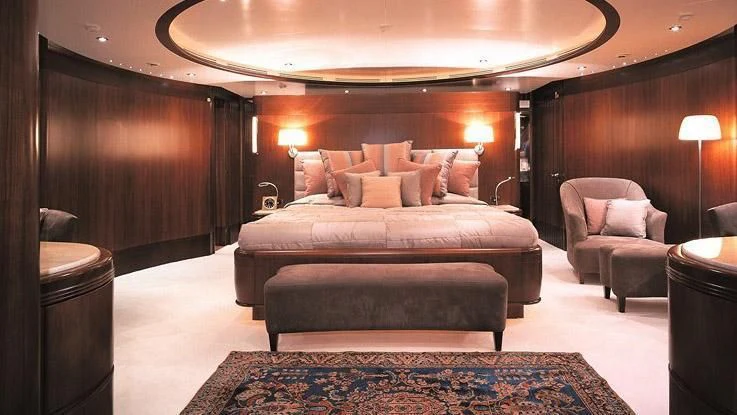 a large bed in a hotel room aboard MORE Yacht for Sale