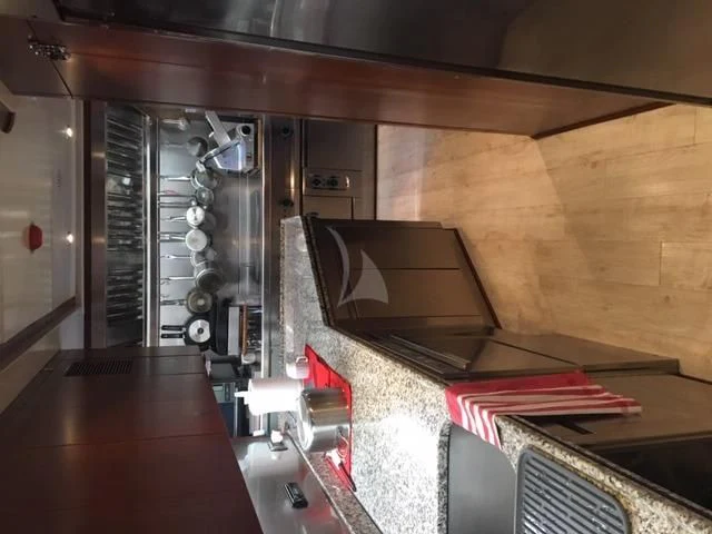 a computer on a table aboard MORE Yacht for Sale