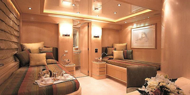 a room with a bed and a couch aboard MORE Yacht for Sale