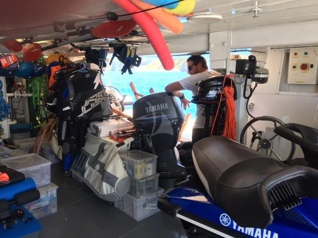 a person working on a machine aboard MORE Yacht for Sale