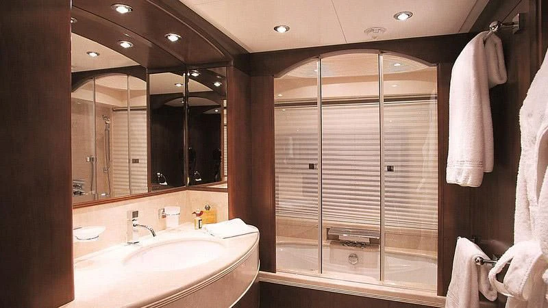 a bathroom with a large mirror aboard MORE Yacht for Sale