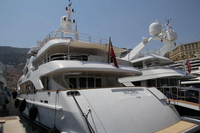 a couple of boats are parked in a harbor aboard MORE Yacht for Sale
